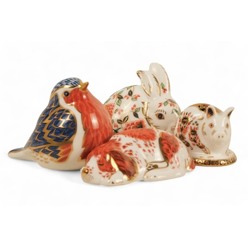 242 - A Royal Crown Derby rabbit paperweight - 7cm high, together with three others in the form of a robin... 