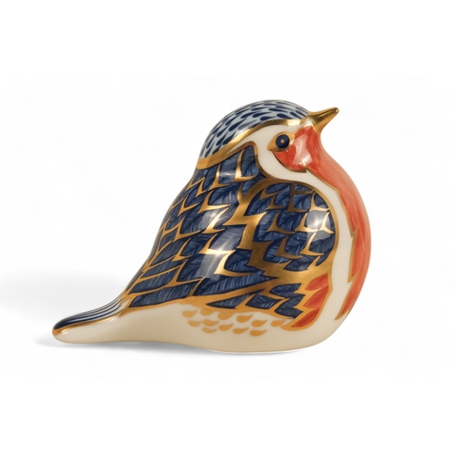 242 - A Royal Crown Derby rabbit paperweight - 7cm high, together with three others in the form of a robin... 