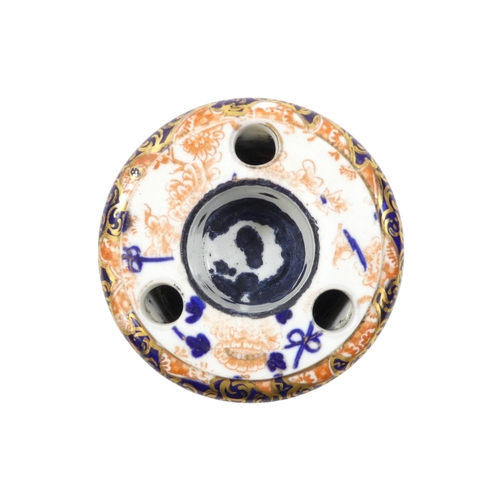 253 - A Royal Crown Derby inkwell - circular with cover and decorated in the Imari style, 8cm diameter, to... 