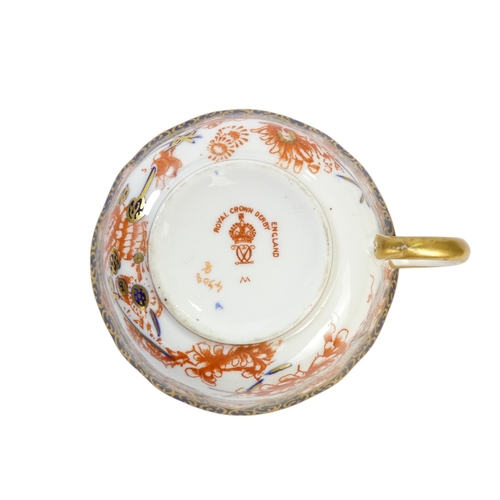 254 - A Royal Crown Derby teacup and saucer - decorated with the Imari style, together with another simila... 