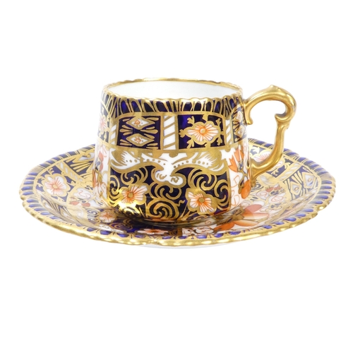 254 - A Royal Crown Derby teacup and saucer - decorated with the Imari style, together with another simila... 