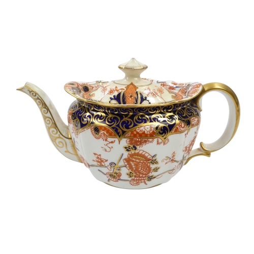 256 - A Royal Crown Derby bachelor teapot - of oval fluted form with Imari style decoration, 11cm high, to... 