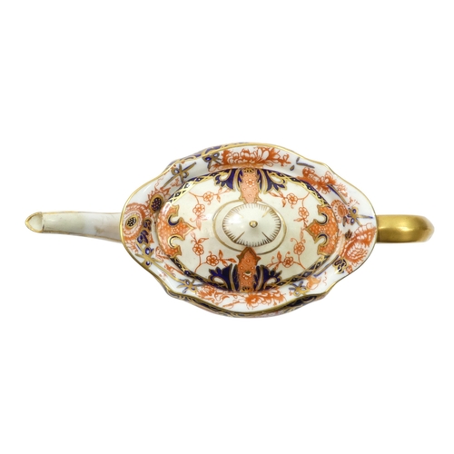 256 - A Royal Crown Derby bachelor teapot - of oval fluted form with Imari style decoration, 11cm high, to... 