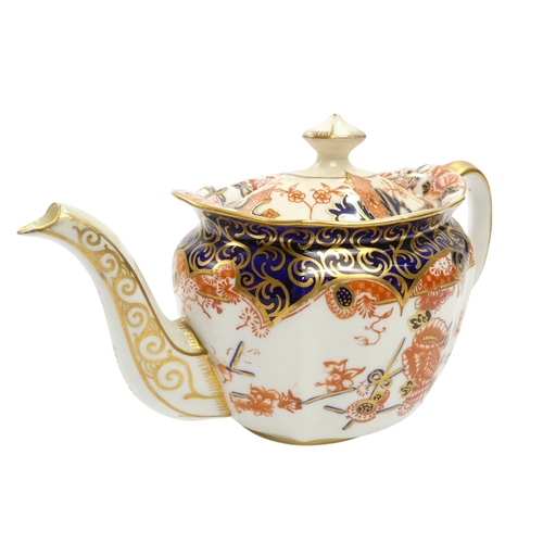 256 - A Royal Crown Derby bachelor teapot - of oval fluted form with Imari style decoration, 11cm high, to... 