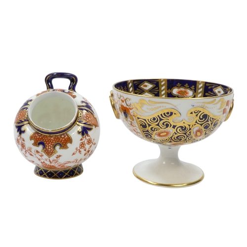 257 - A Royal Crown Derby chalice - decorated in an Imari pattern with gilt ring handles, 8cm high, togeth... 