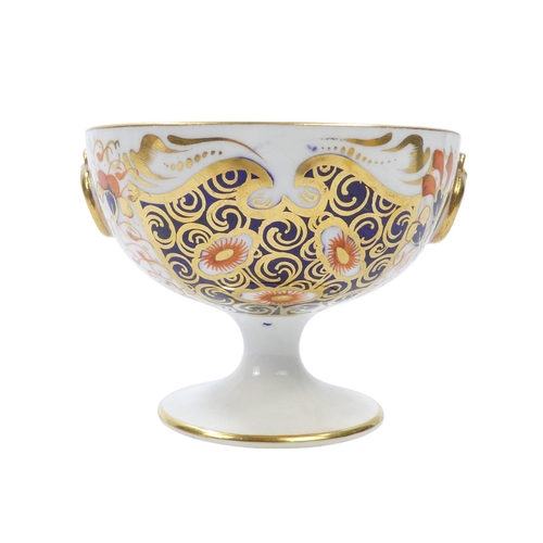 257 - A Royal Crown Derby chalice - decorated in an Imari pattern with gilt ring handles, 8cm high, togeth... 