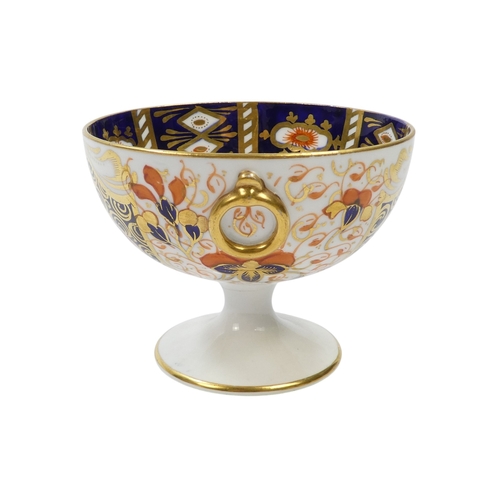 257 - A Royal Crown Derby chalice - decorated in an Imari pattern with gilt ring handles, 8cm high, togeth... 