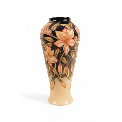 262 - A Moorcroft Pottery vase of baluster form - 'Peruvian Lily' pattern designed by Sian Leeper with tub... 