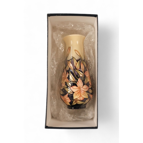 262 - A Moorcroft Pottery vase of baluster form - 'Peruvian Lily' pattern designed by Sian Leeper with tub... 