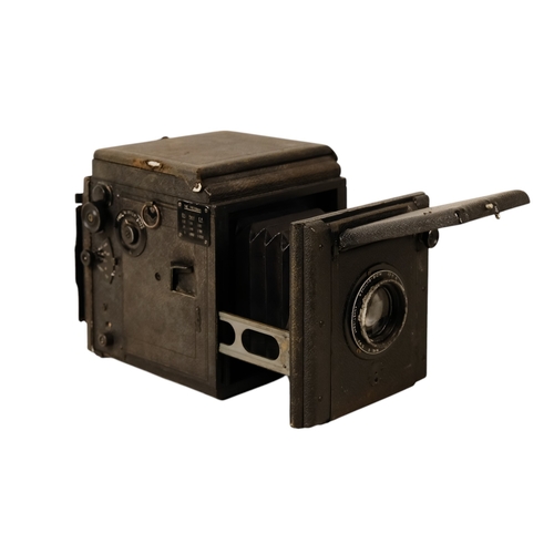 28 - A Butcher Popular Pressman reflex camera - covered in black rexine, together with several camera bac... 