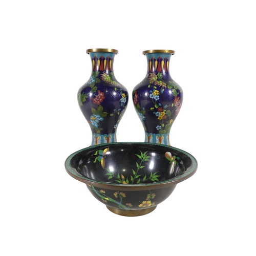 334 - A pair of early 20th century cloisonne vases - of baluster form, decorated with flowers on a blue gr... 