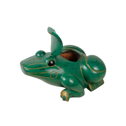 36 - An Indonesian green painted wooden frog - with gilt decoration and a hinged compartment to its back,... 