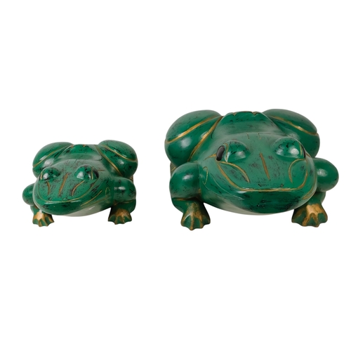 36 - An Indonesian green painted wooden frog - with gilt decoration and a hinged compartment to its back,... 