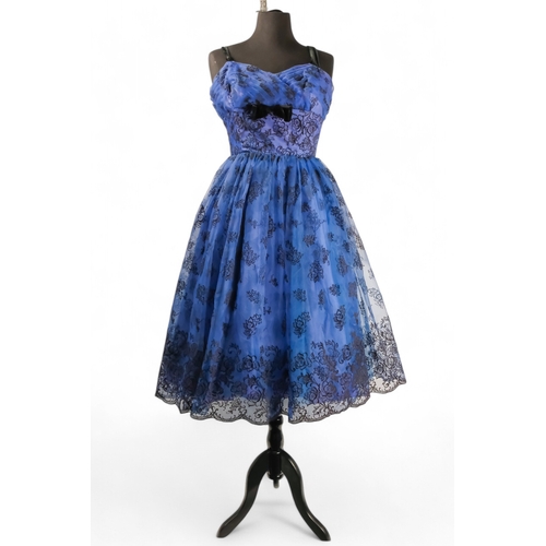 394 - A Brilkie Models evening dress - the iridescent blue fabric with flower, bead and sequin decoration,... 