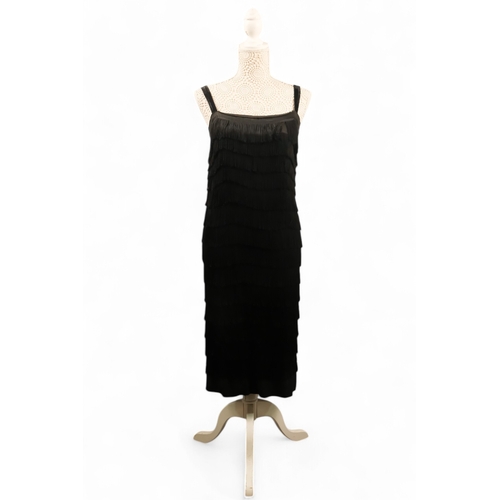 397 - A black 'Flapper' style dress - with black velvet straps, size 10/12, length 90cm.