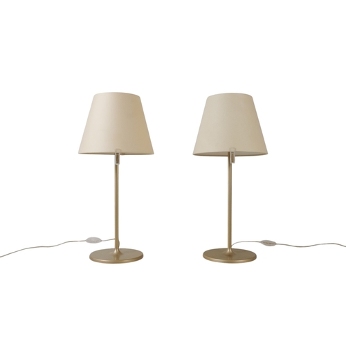 47 - Adrien Gardere (b. 1972) for Artemide, a pair of table lamps - with tilting cream shades on bronzed ... 