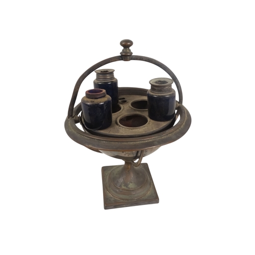 553 - A late 19th century silver plated 'ships' ink stand - of globe form and mounted on a gimble raised o... 