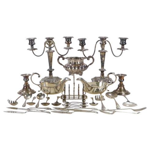 557 - A quantity of 20th century plated wares - including a pair of three branch candlesticks, two large s... 