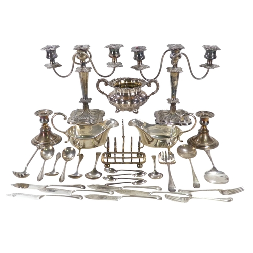 557 - A quantity of 20th century plated wares - including a pair of three branch candlesticks, two large s... 