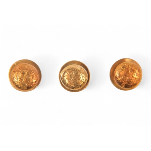 590 - A set of three 18ct gold shirt studs - with foliate decoration, 2.4g, boxed.