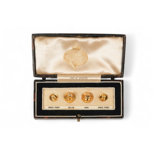 591 - A set of four 9ct gold shirt studs - in smart leather silk lined retail box for D.S. Morgan of Neath... 