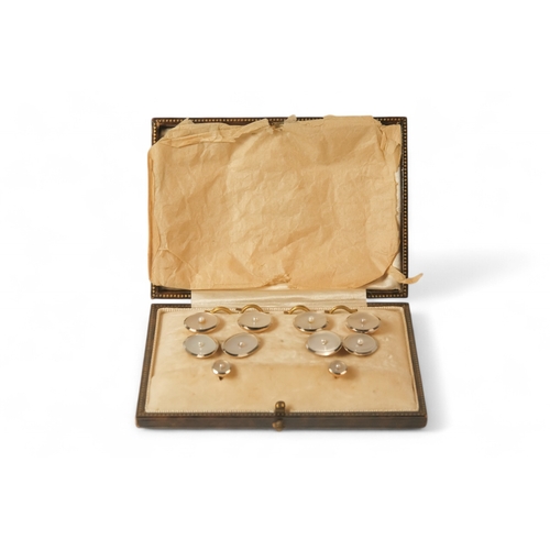 592 - A boxed set of 18ct gold shirt studs and cufflinks - mother-of-pearl and pearl set, 15.6g.