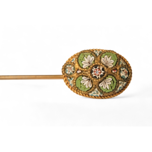 595 - A late 19th century Italian micro mosaic stickpin - oval with floral decoration, 2.3g.