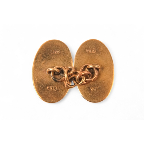 600 - A pair of 9ct gold cufflinks - oval chain linked and engraved initials G and W, 5.1g.