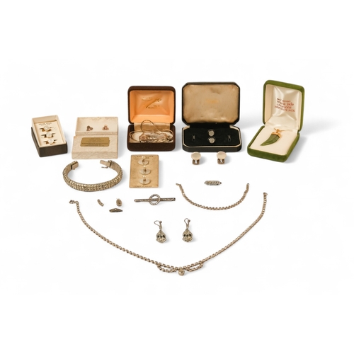 609 - A small quantity of costume jewellery - including a jade and silver gilt mounted pendant.