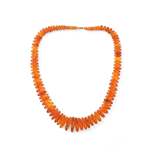 614 - A string of amber beads - length 50cm, together with a further string of amber beads.