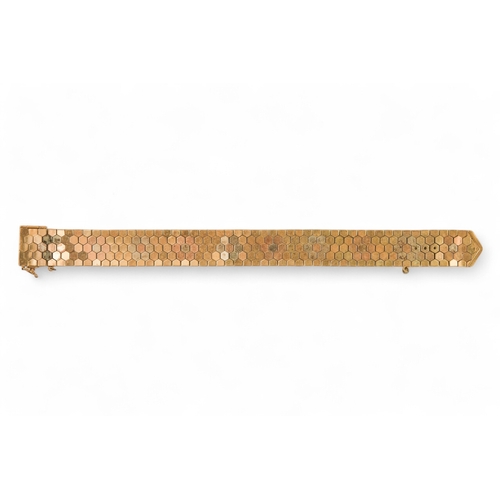 617 - A 9ct gold bracelet - of belt form constructed of articulated hexagons, 43.6g.