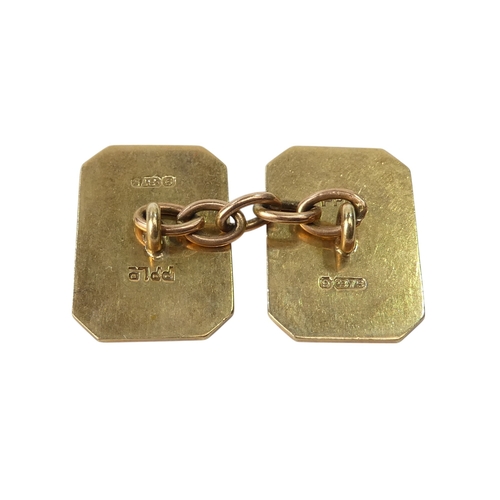 623 - A pair of 9ct gold cuff links - rectangular with canted corners with an engine turned finish, 6.5g.