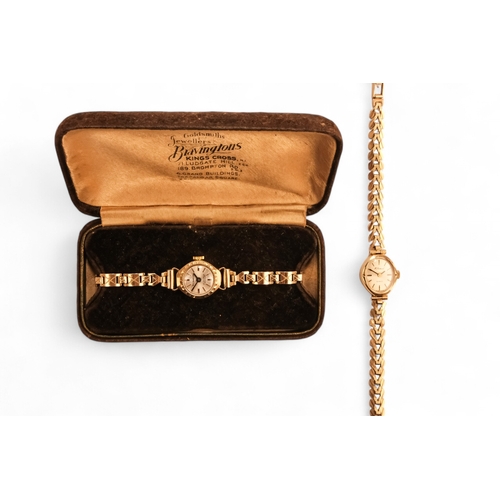 704 - A ladies 9ct gold cocktail watch - oval with a cream dial set out in baton numerals, 10.2g all in, t... 