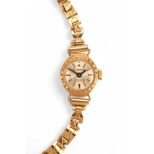 704 - A ladies 9ct gold cocktail watch - oval with a cream dial set out in baton numerals, 10.2g all in, t... 