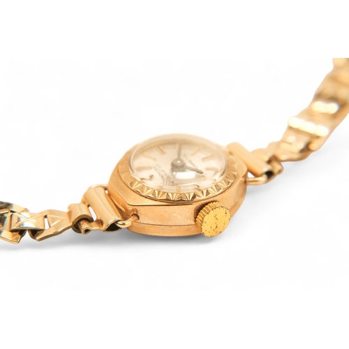 704 - A ladies 9ct gold cocktail watch - oval with a cream dial set out in baton numerals, 10.2g all in, t... 