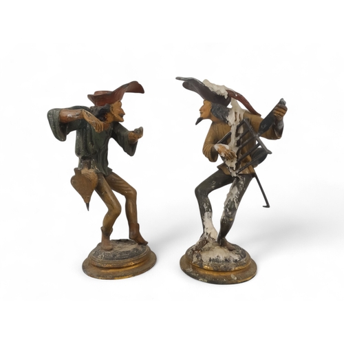 8 - A pair of late 19th century continental spelter candlesticks - modelled as grotesque jesters, 28cm h... 