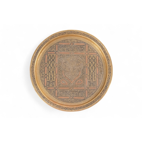 85 - An early 20th century Ottoman brass tray - circular and inlaid with white metal and copper, 34cm dia... 