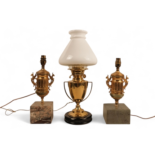 90 - A pair of brass and marble table lamps - raised on square marble bases, together with another table ... 