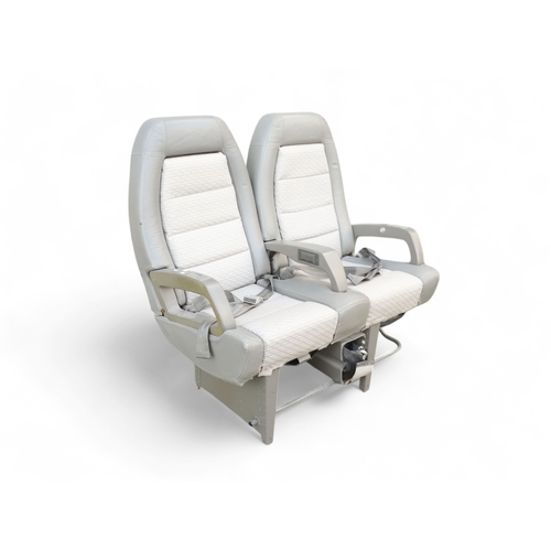 901 - A Siamese pair of aircraft seats from Concorde - in grey Connolly leather and cloth, with tilting ba... 