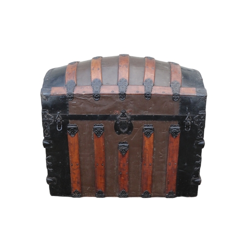 902 - A late 19th century domed trunk - tin on a wooden frame and lathes with steel brackets, 90 x 54 x 79... 