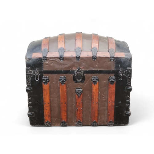 902 - A late 19th century domed trunk - tin on a wooden frame and lathes with steel brackets, 90 x 54 x 79... 