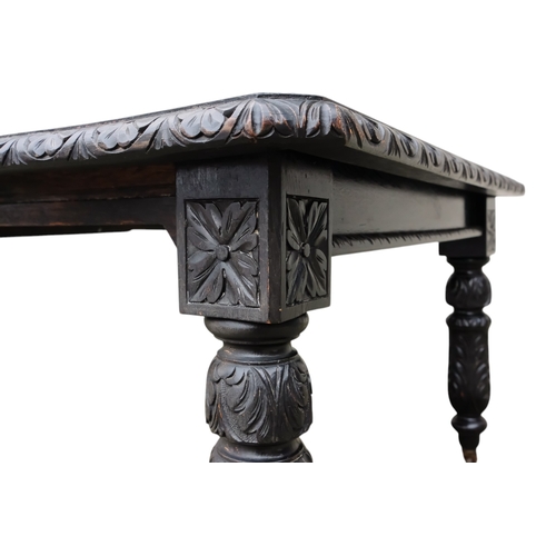 905 - A 17th century style oak extending dining table - with two leaf insertions, the rectangular top with... 