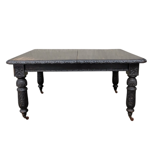 905 - A 17th century style oak extending dining table - with two leaf insertions, the rectangular top with... 