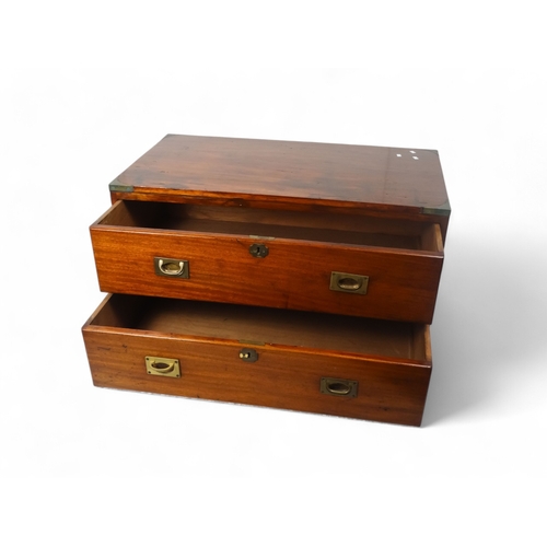 920 - A late Victorian camphorwood chest - rectangular with brass angle brackets and two graduated drawers... 