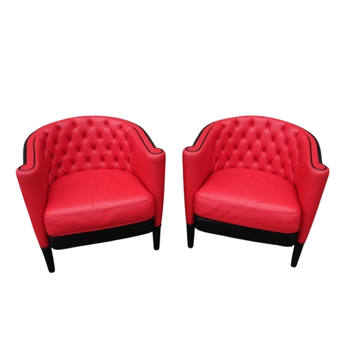 939 - A pair of Moroso leather upholstered tub chairs - button upholstered in red contrasted with black, o... 