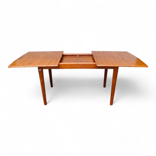 947 - A Gordon Russell, Broadway walnut extending dining table - the rectangular top on rectangular taperi... 