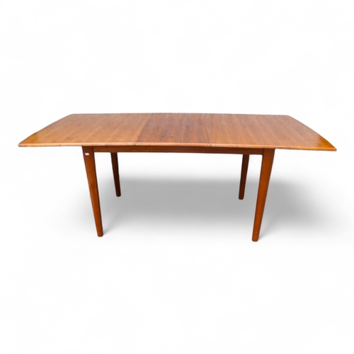 947 - A Gordon Russell, Broadway walnut extending dining table - the rectangular top on rectangular taperi... 