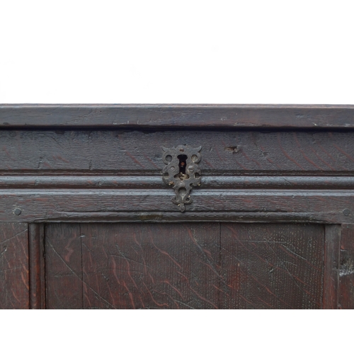 948 - A 17th century style oak refectory table - the rectangular plank top above square and baluster turne... 