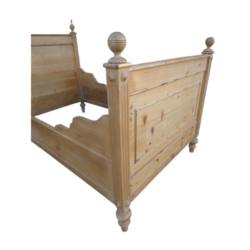 949 - A late 19th century French pine lit-en-bateau - with panelled foot and head boards, 117cm wide.