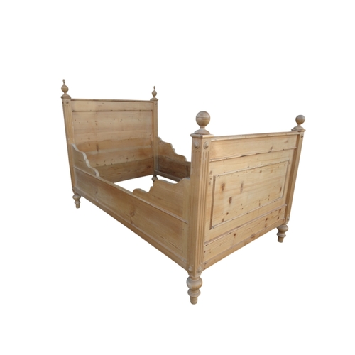 949 - A late 19th century French pine lit-en-bateau - with panelled foot and head boards, 117cm wide.